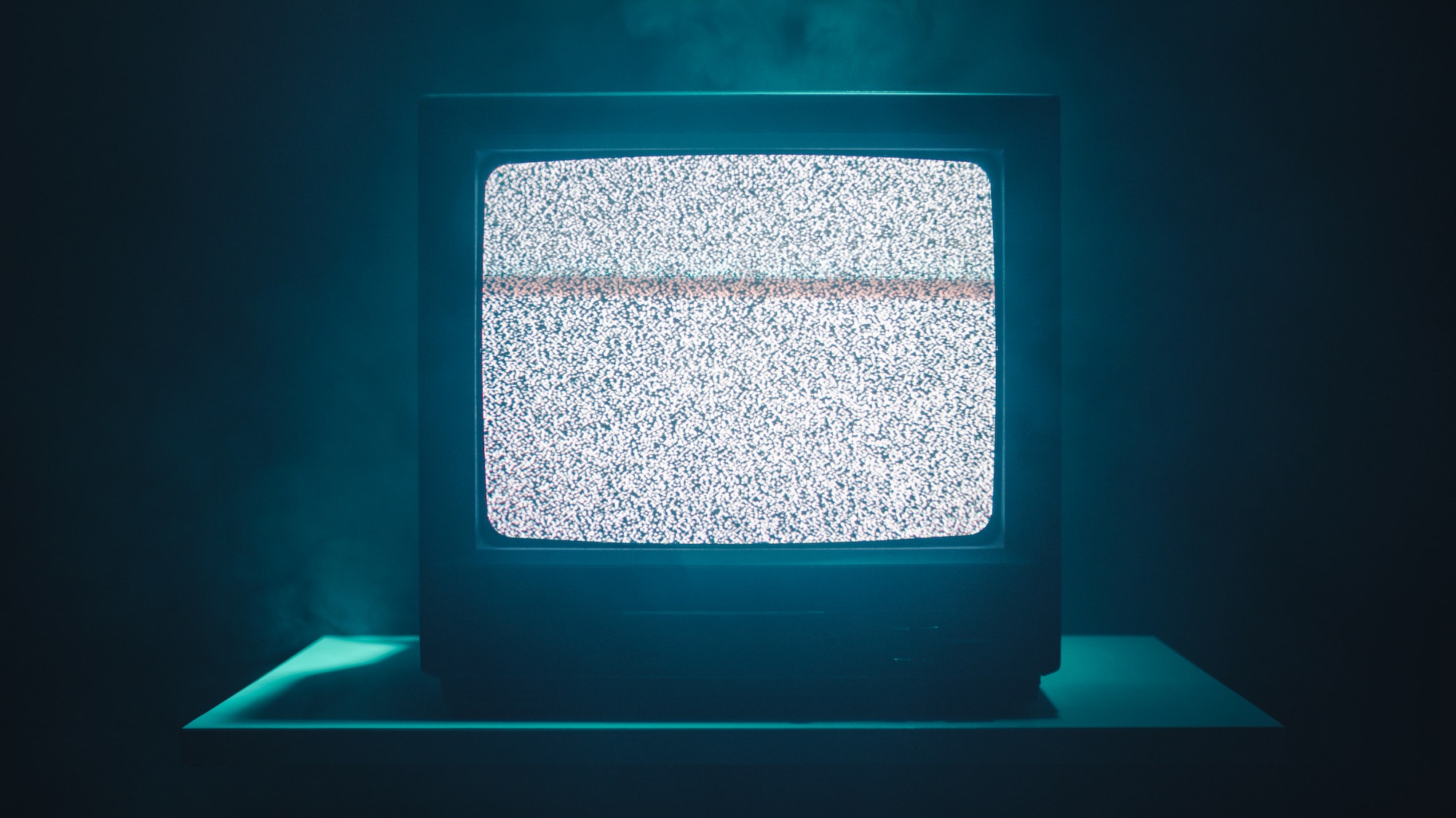Vintage television with bad signal in the night