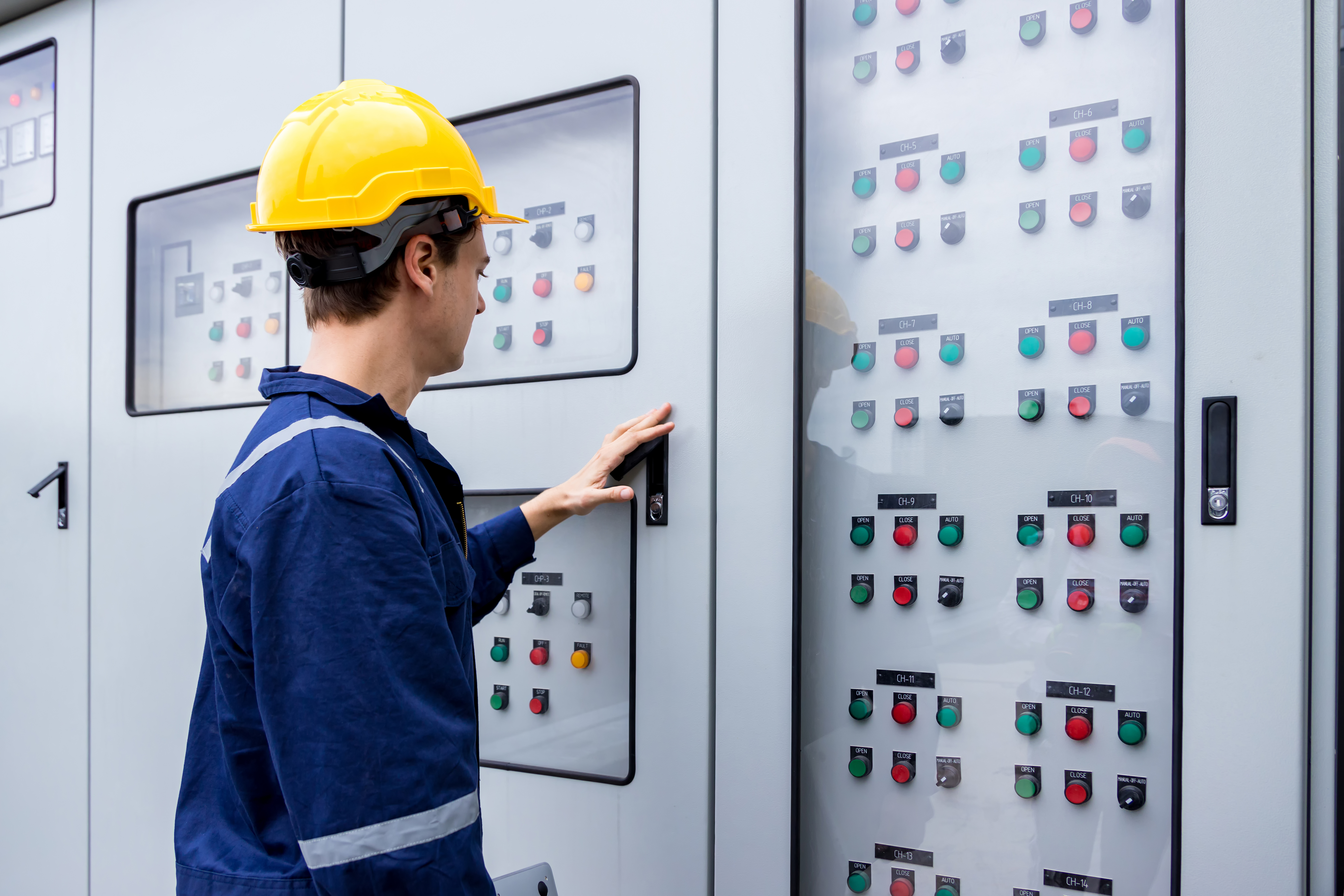 Electrical engineer working in control room.